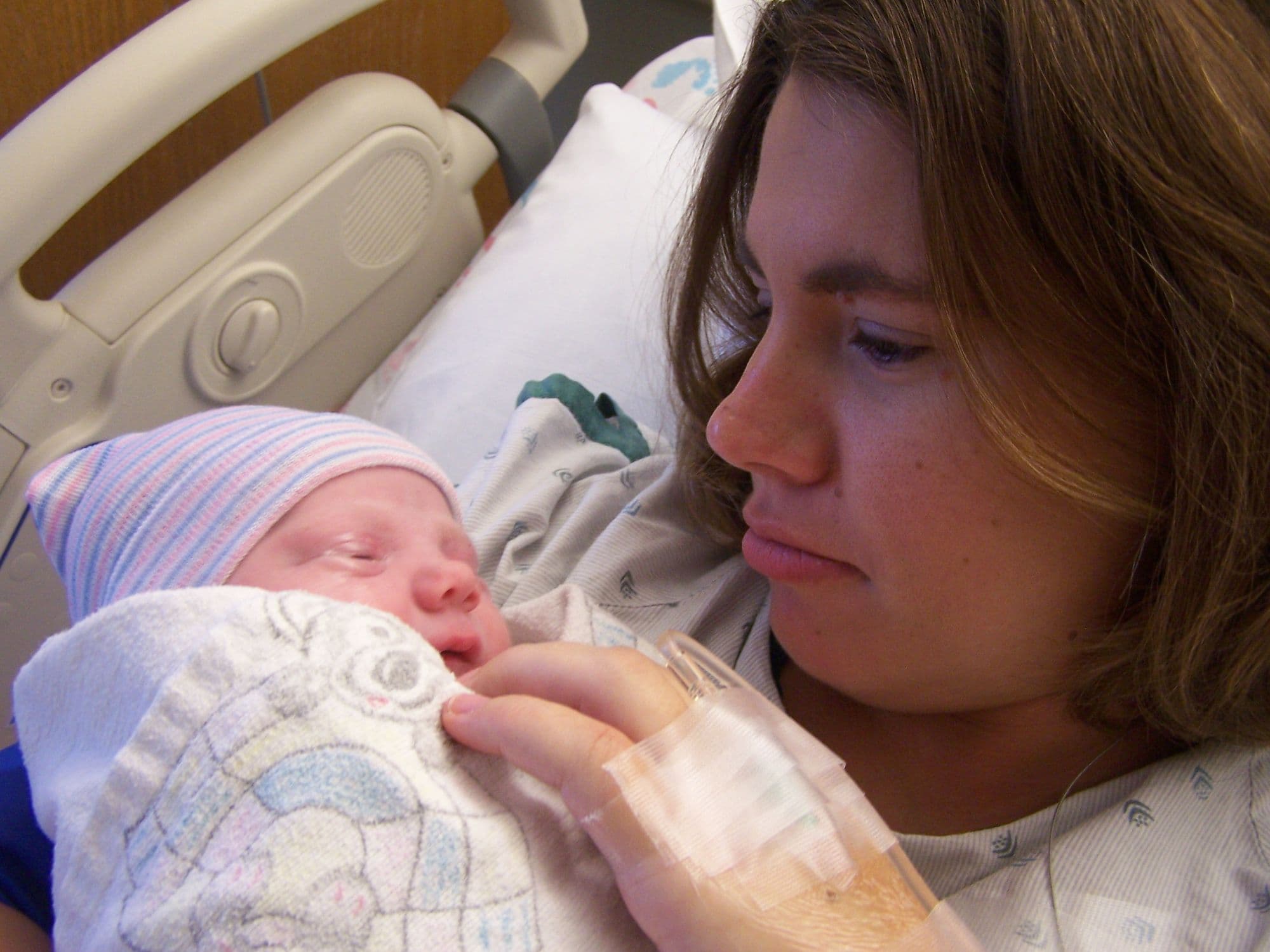 Mother holding a newborn in the hospital