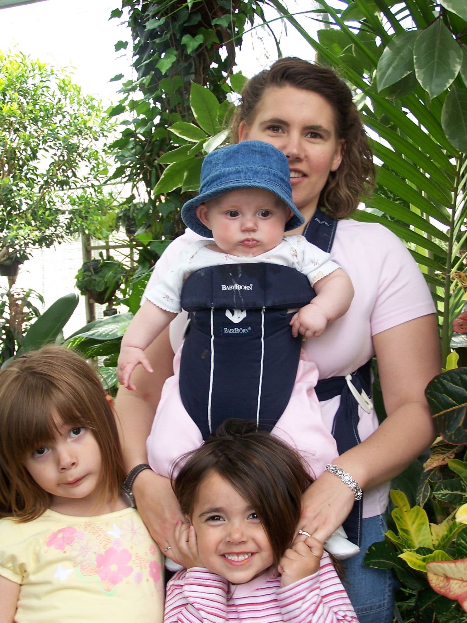 Woman with a baby and two young girls