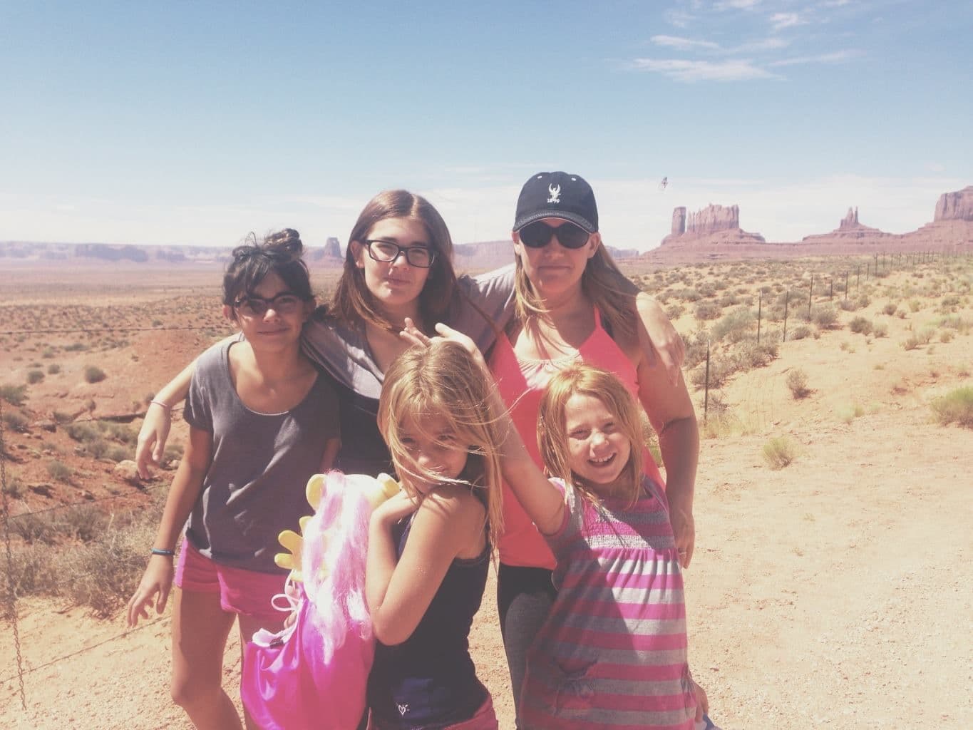 Family of five in desert landscape