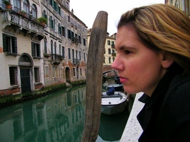 Woman in profile beside a canal