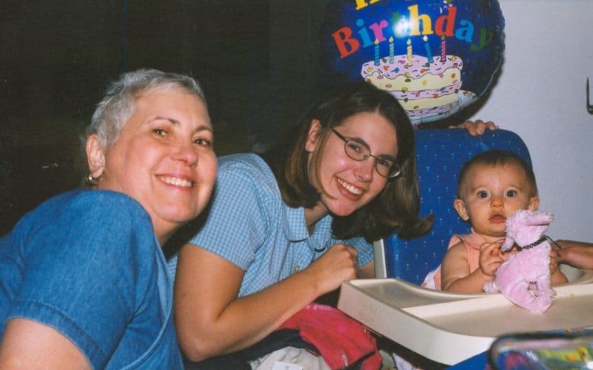 Two women with a baby at a birthday