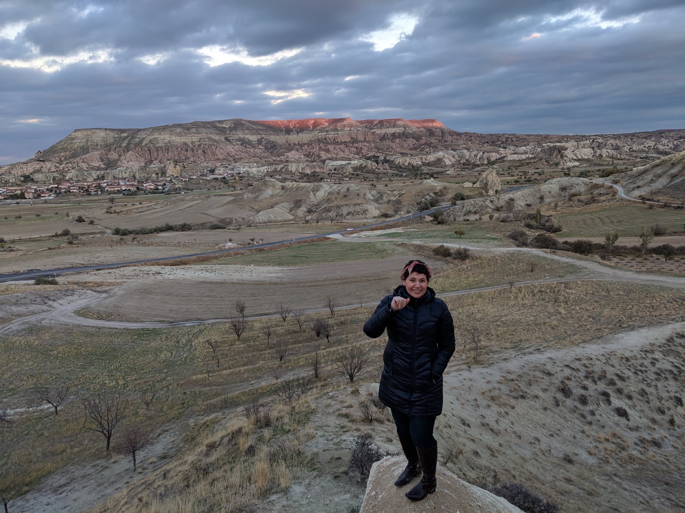 Woman on an overlook above a valley