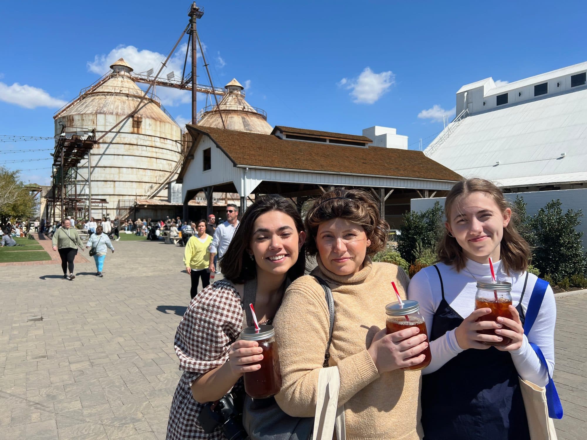 Three generations of women at an outdoor market