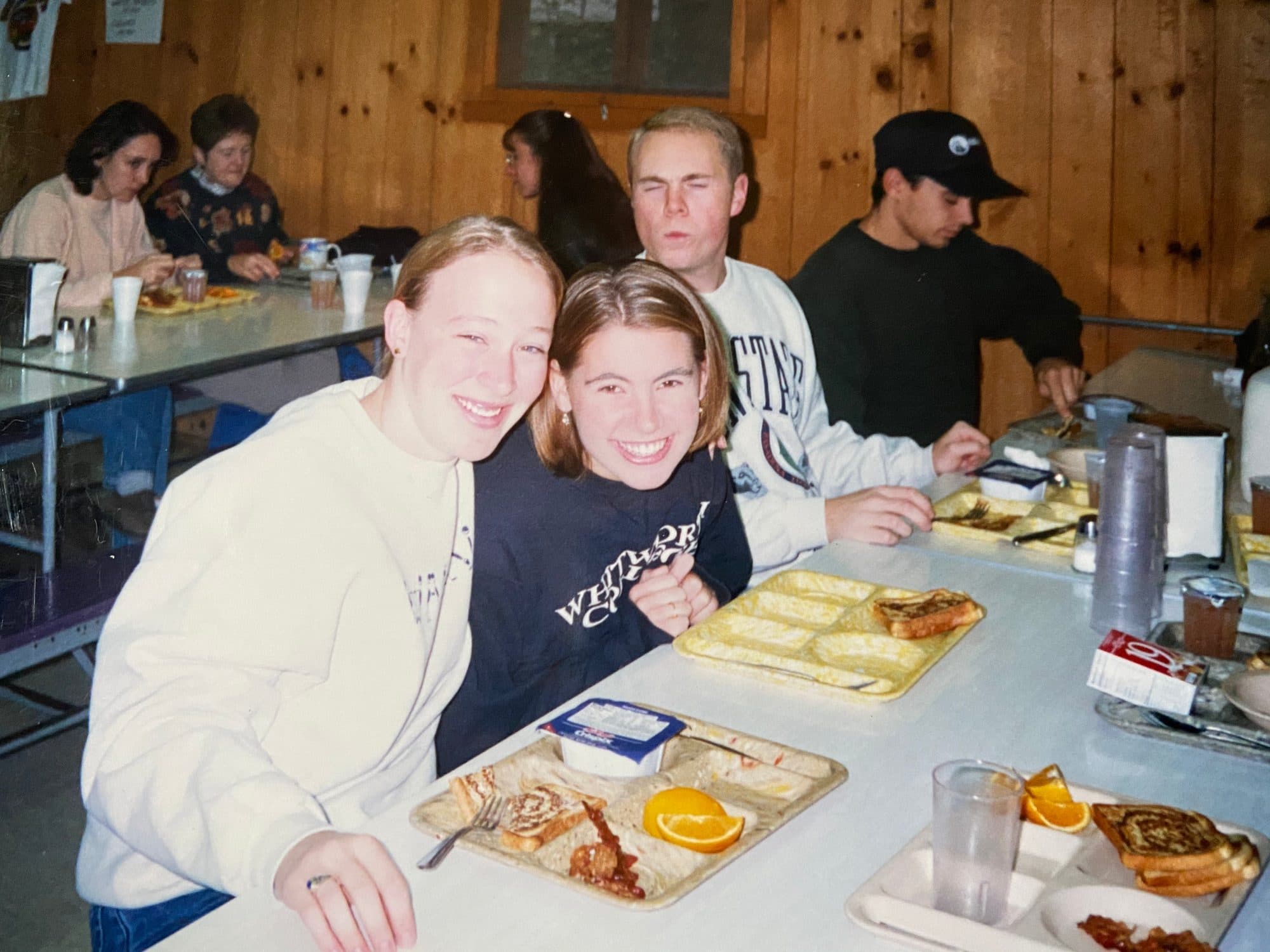 Friends gathered at a cafeteria counter table
