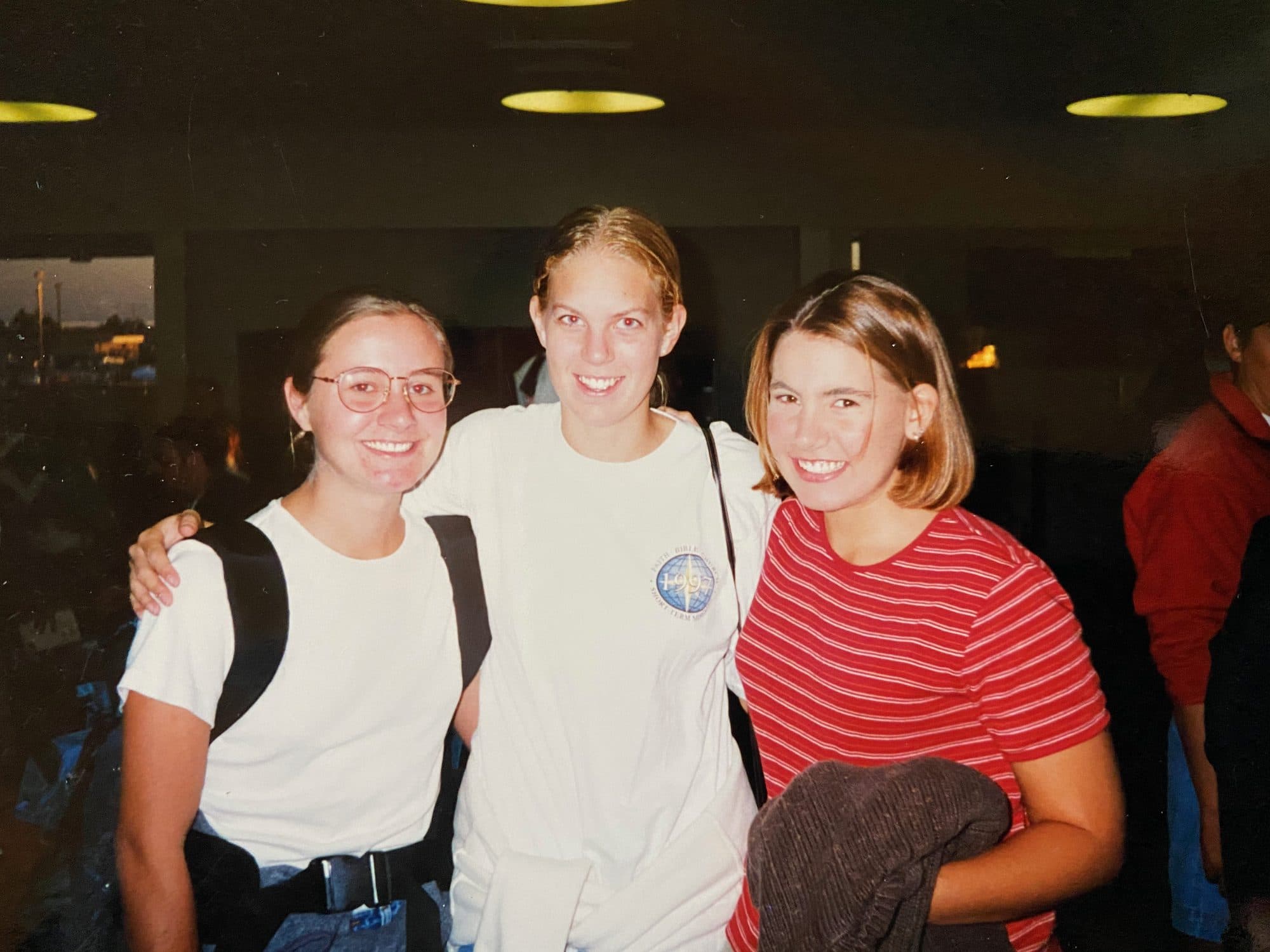 Three young women posing indoors