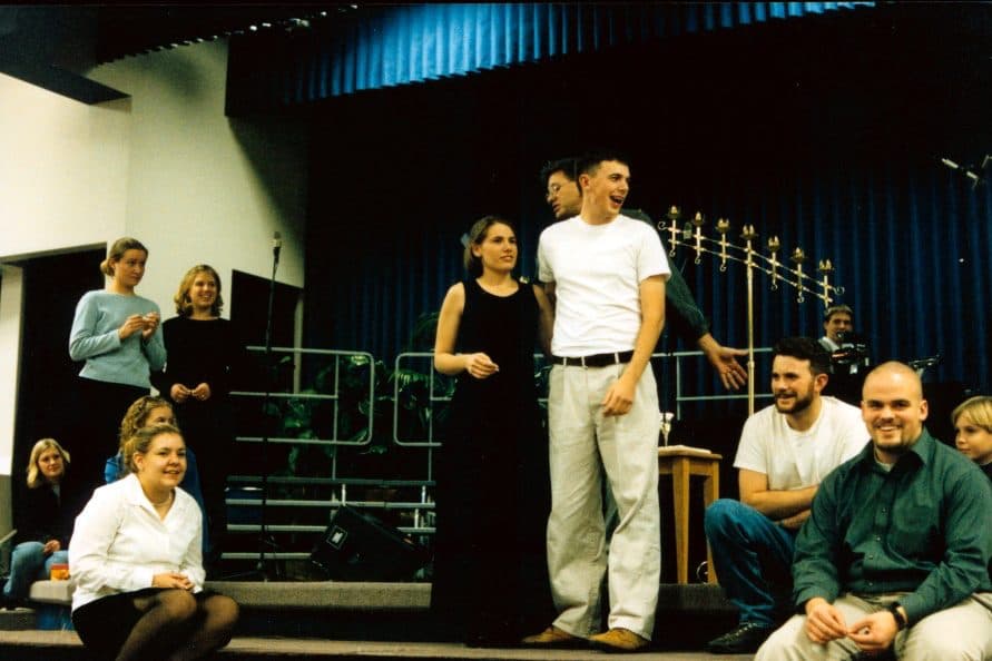 Group posed on a stage