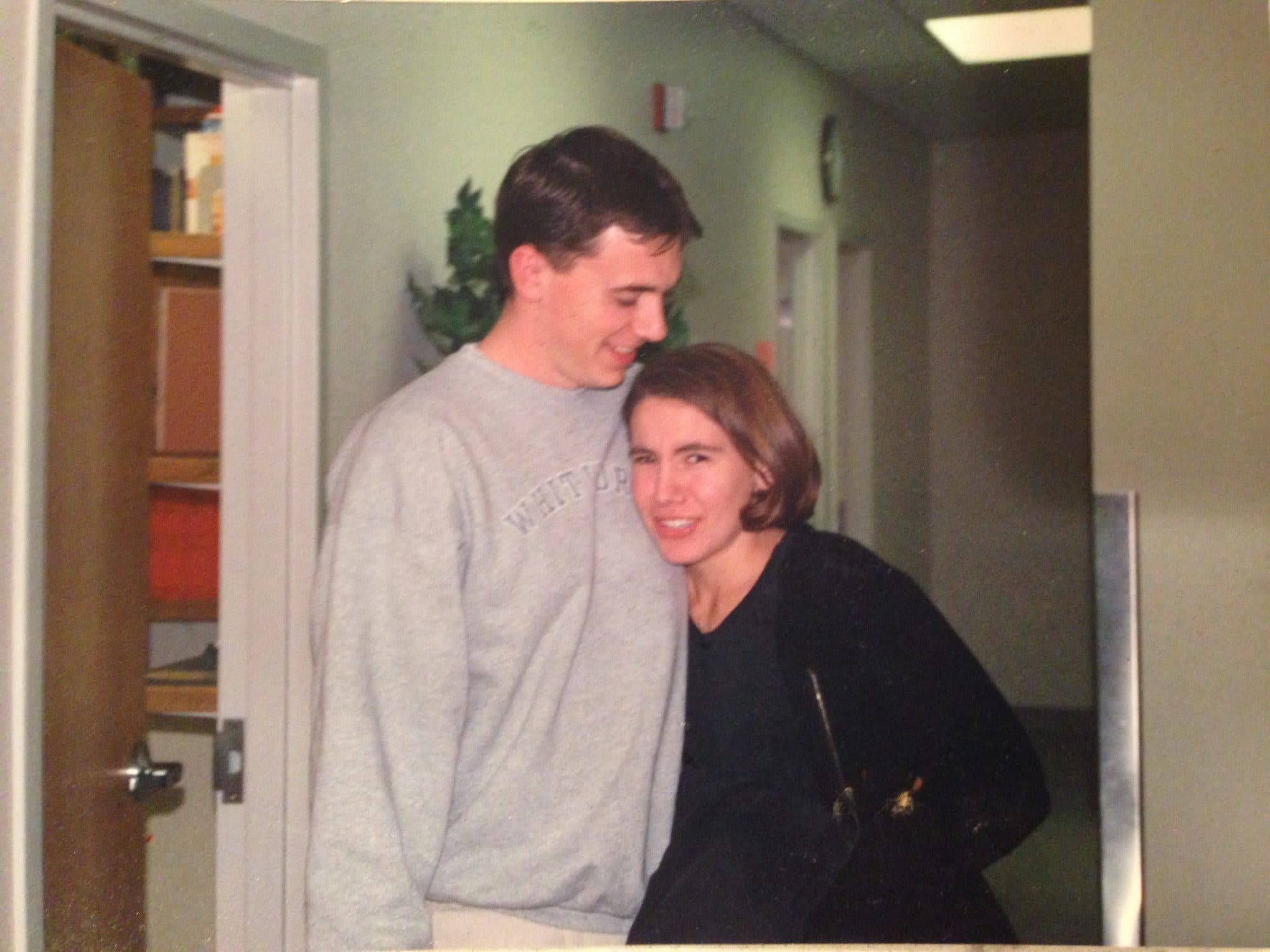 Couple embracing in a hallway