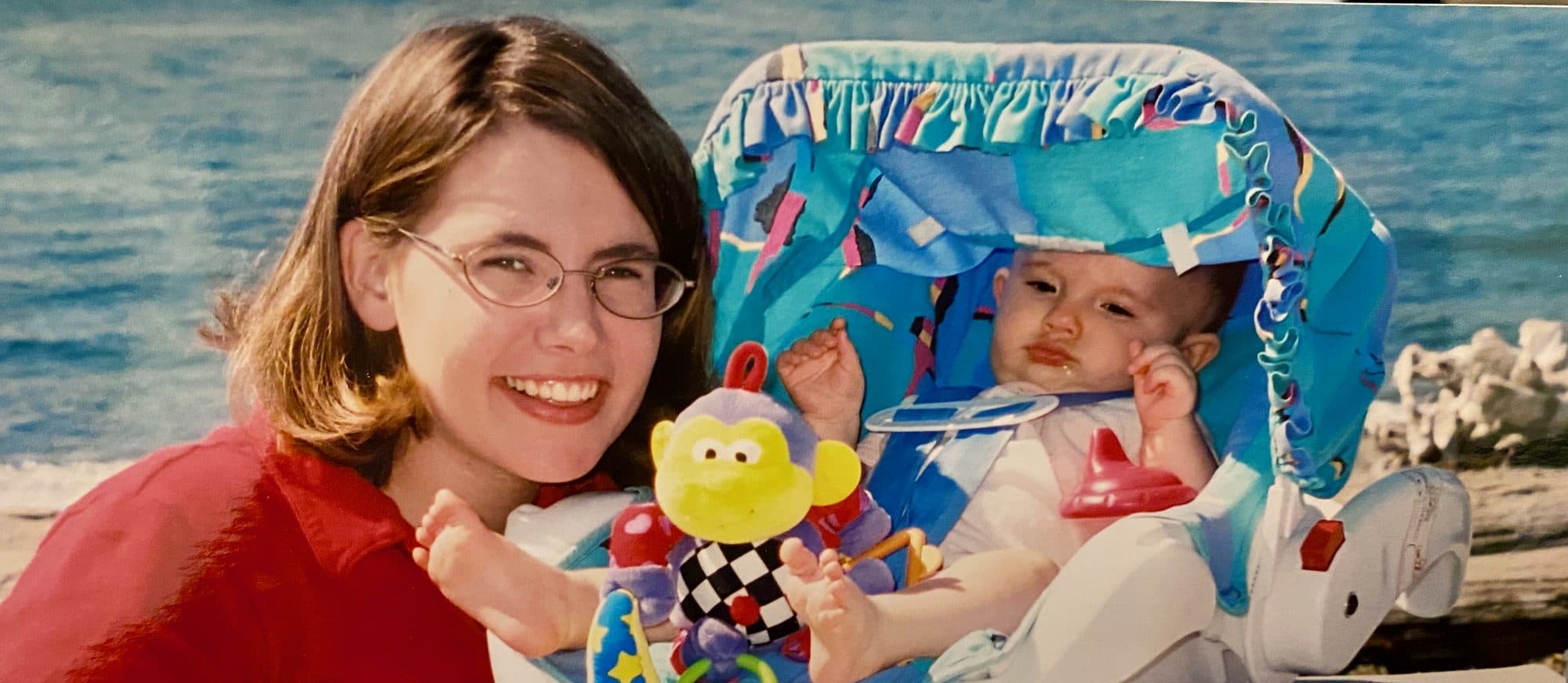 Woman with a baby in a bouncer seat