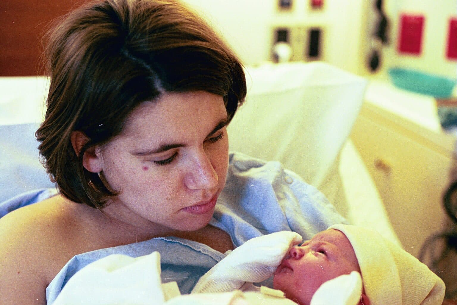 Mother looking down at her newborn