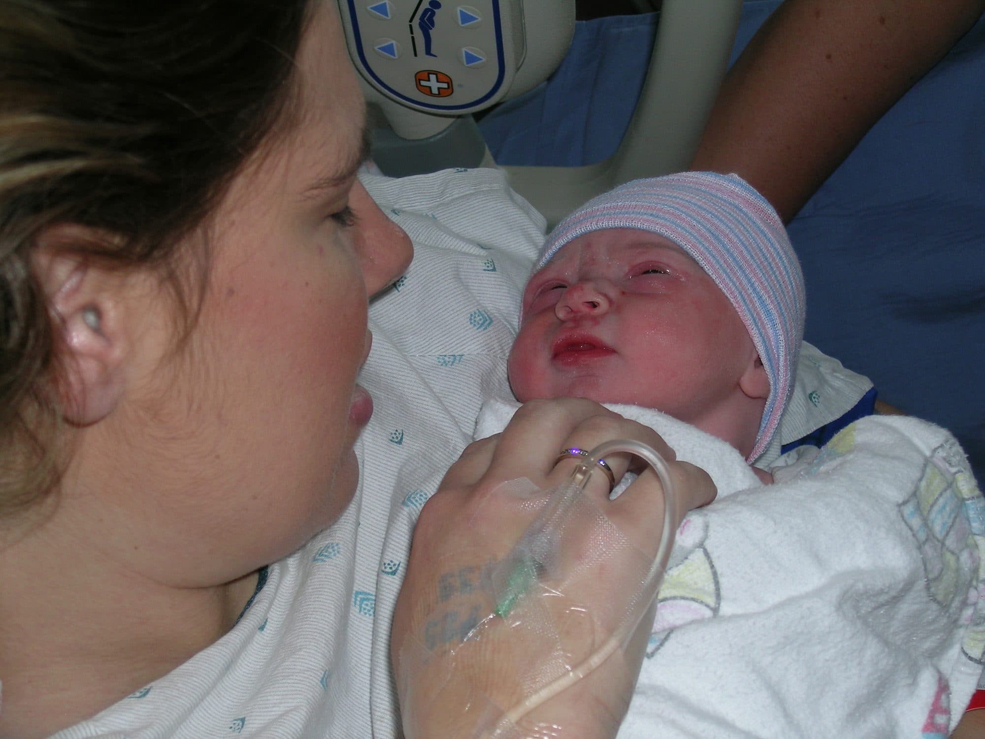 Mother looks at her newborn in the hospital