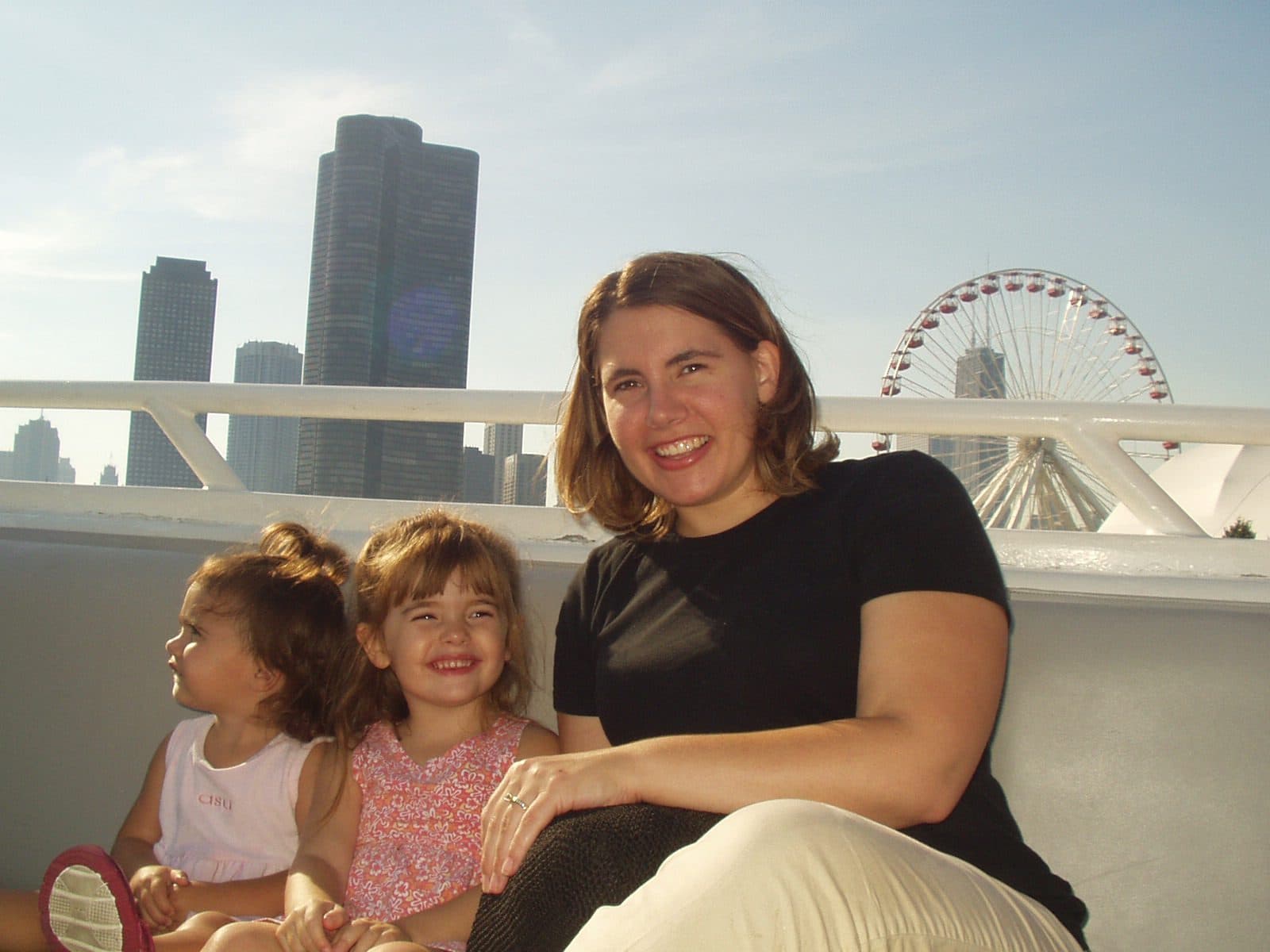 Woman and two girls pose with the Chicago skyline