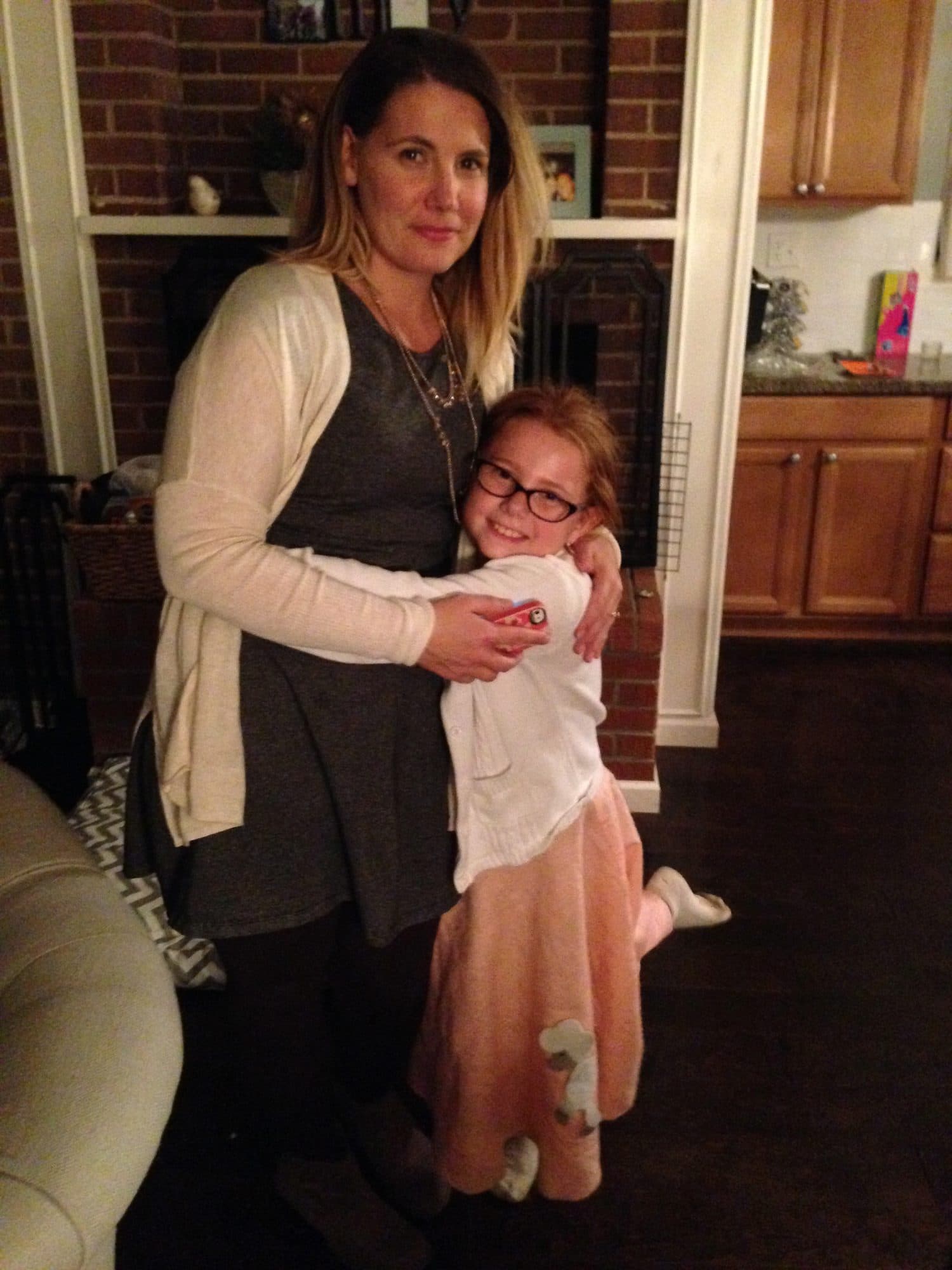Woman holding a young girl