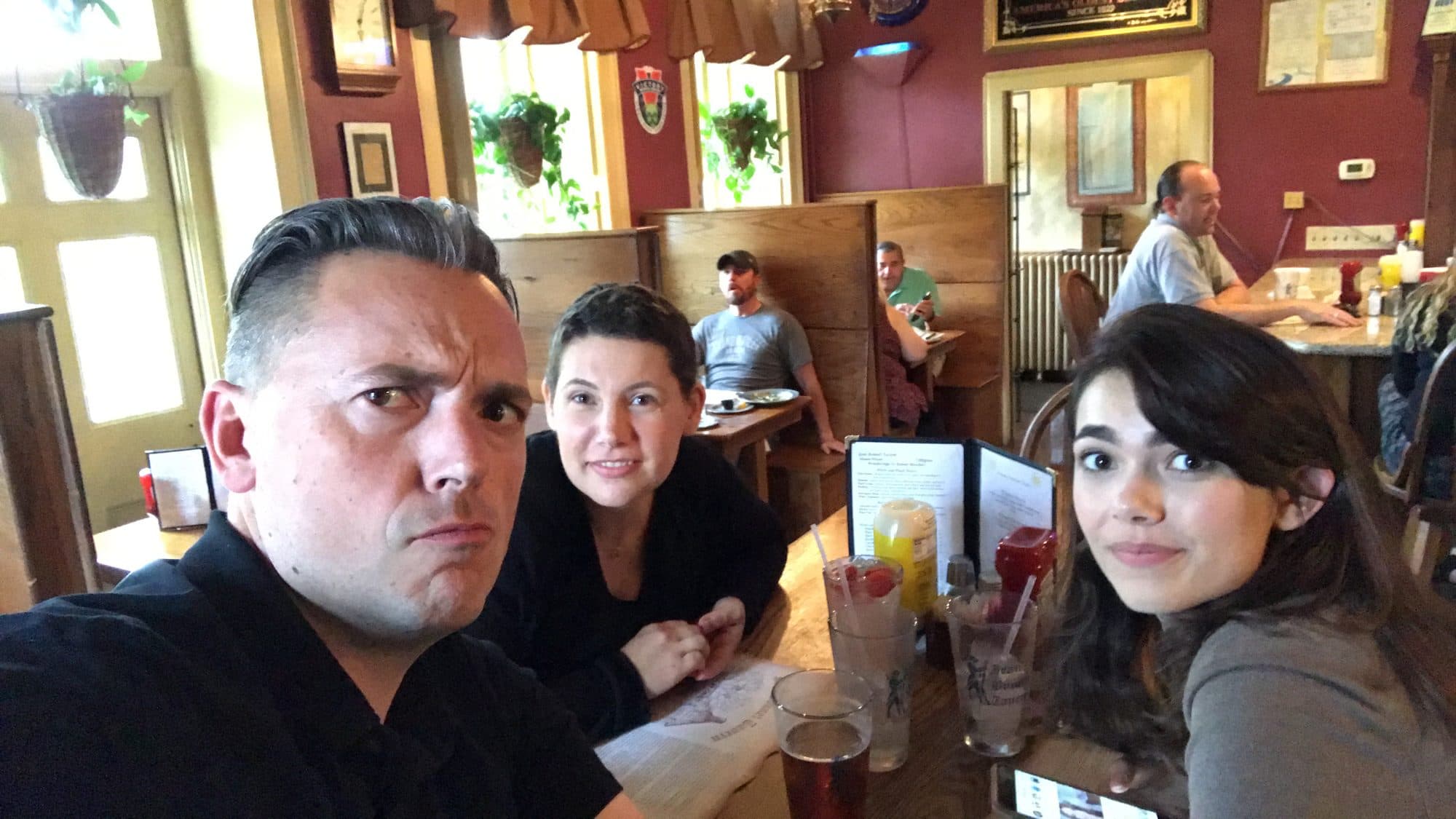 Selfie of three friends at a restaurant