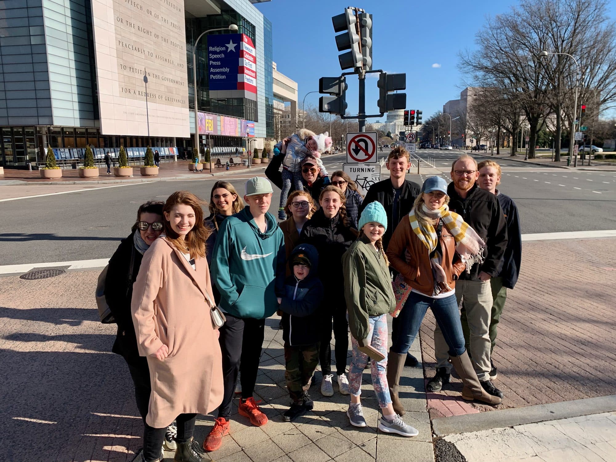 Large family group on a city street corner