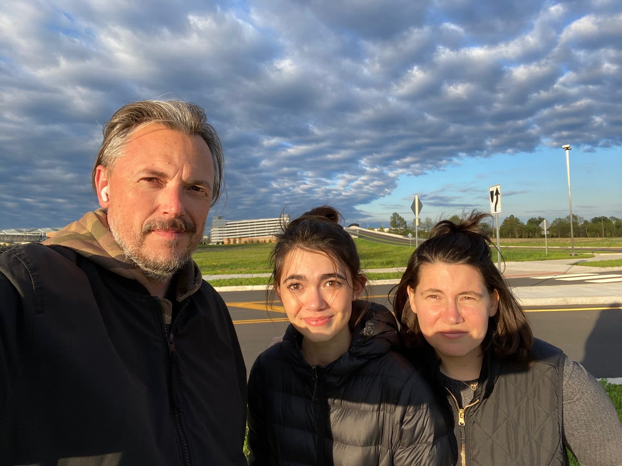 Sunrise selfie with a man, girl, and woman