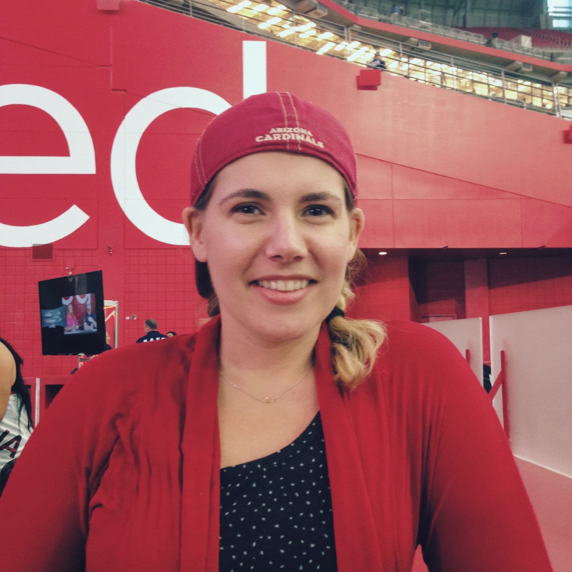 Woman in red at stadium