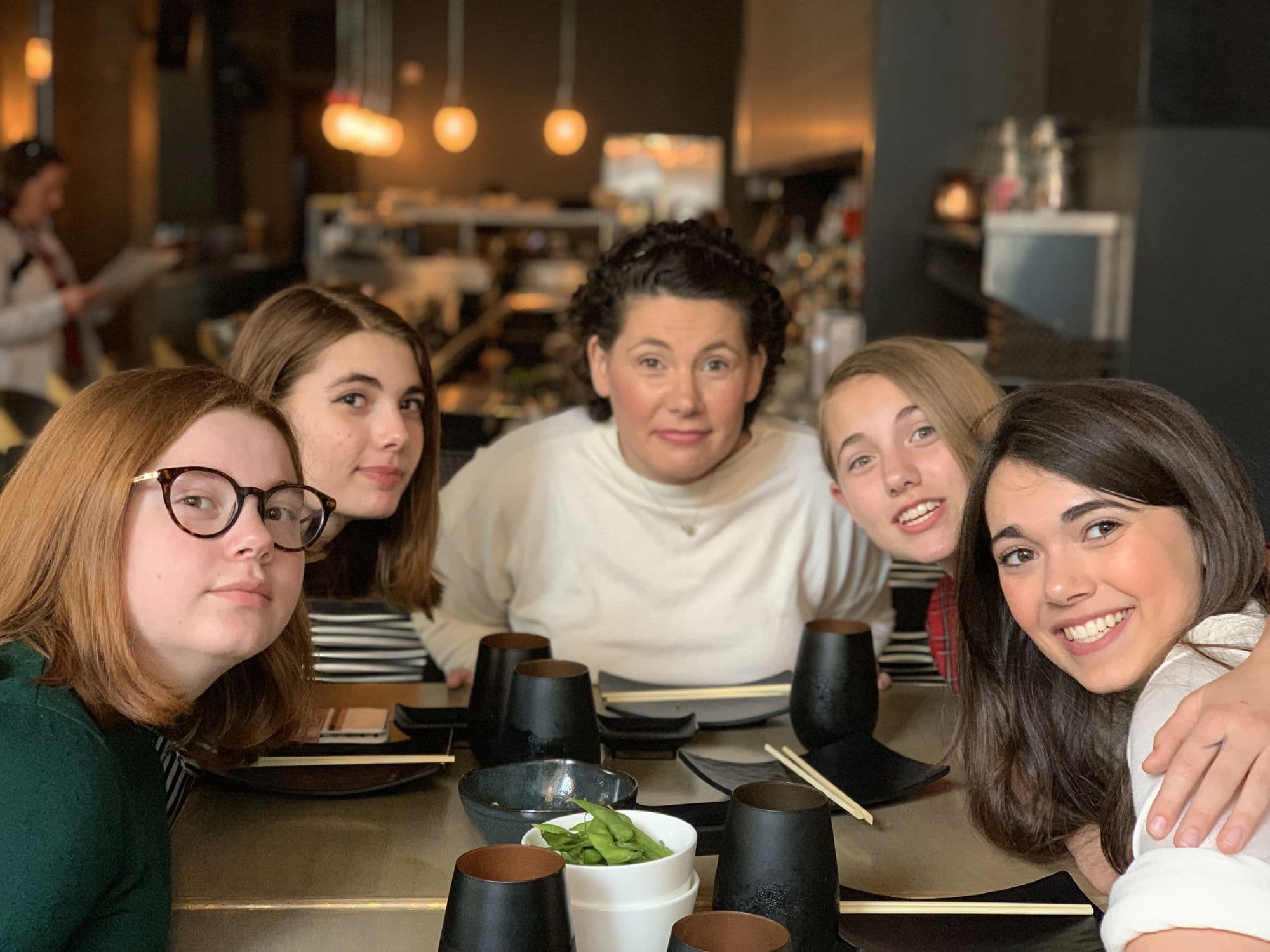 Family gathered at a restaurant table