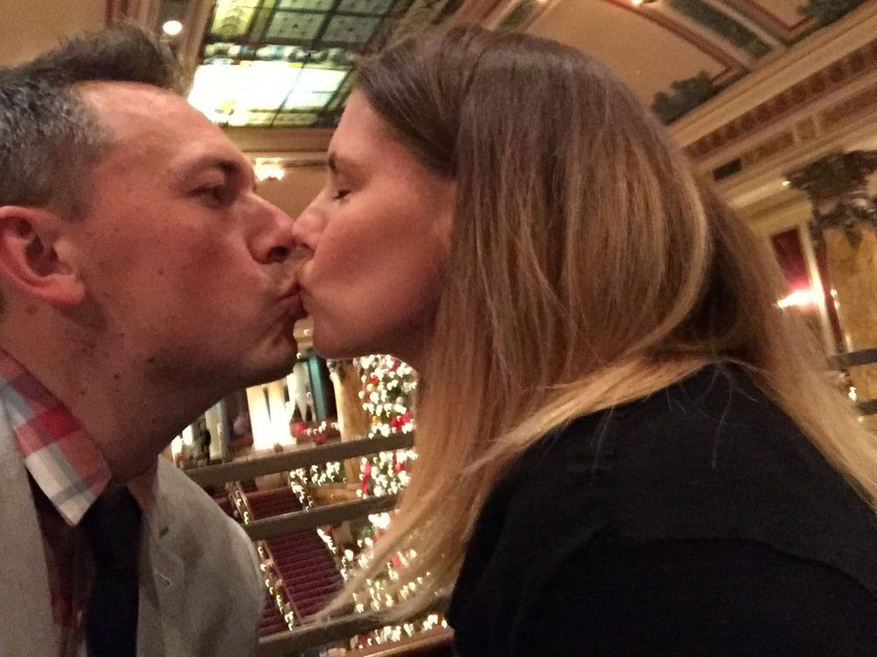 Man and woman kissing indoors