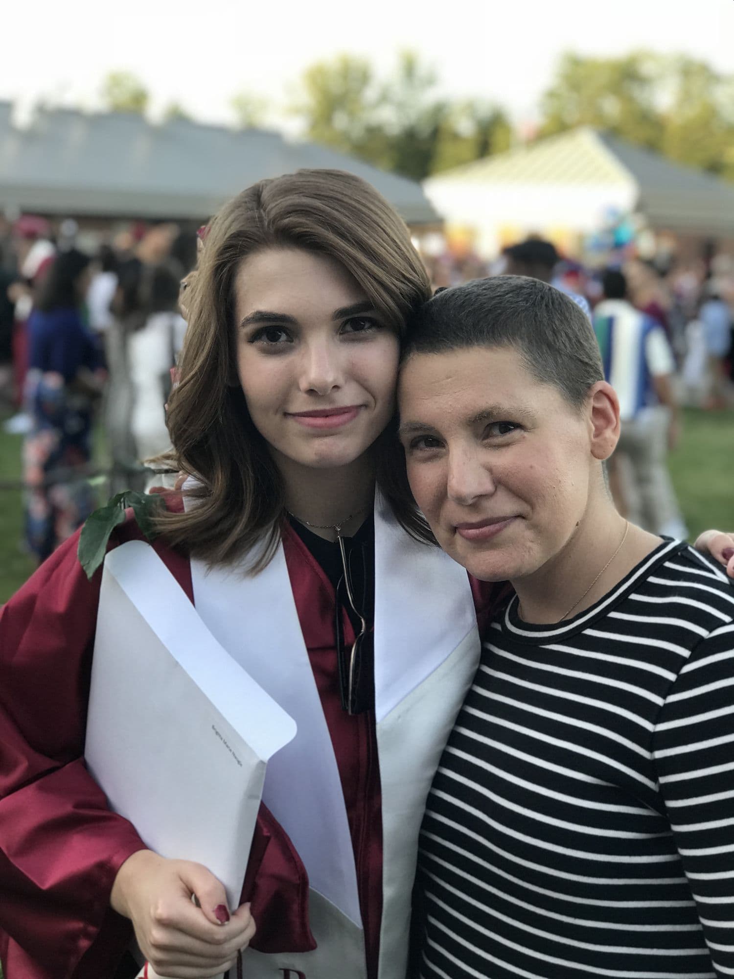 Woman with a graduate in cap and gown