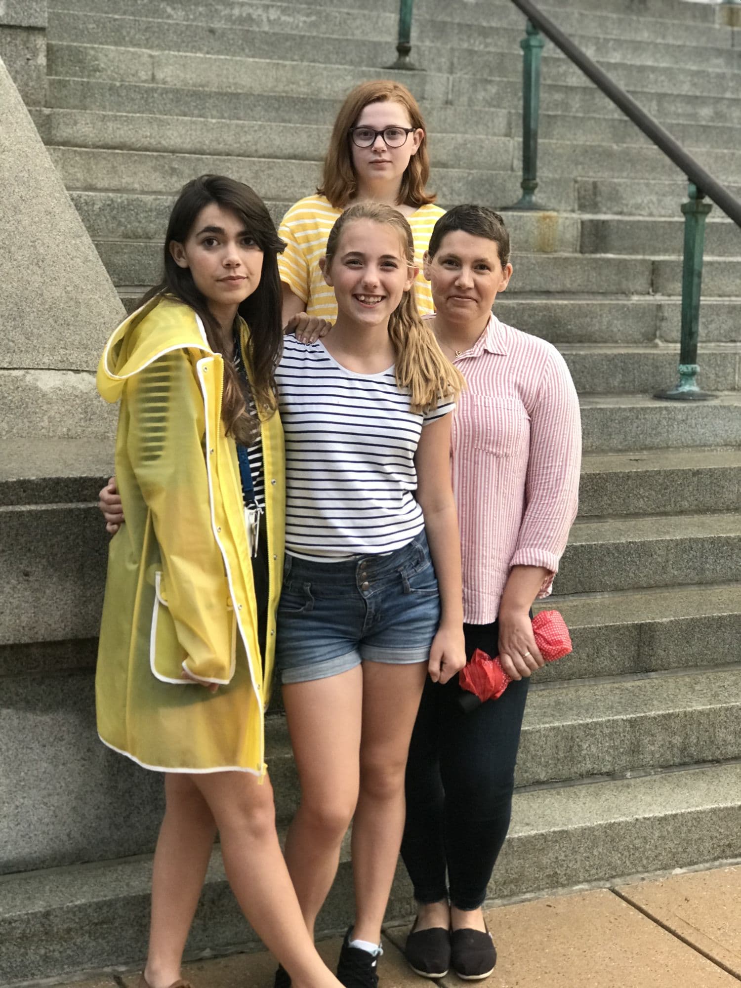 Three women on outdoor stairs