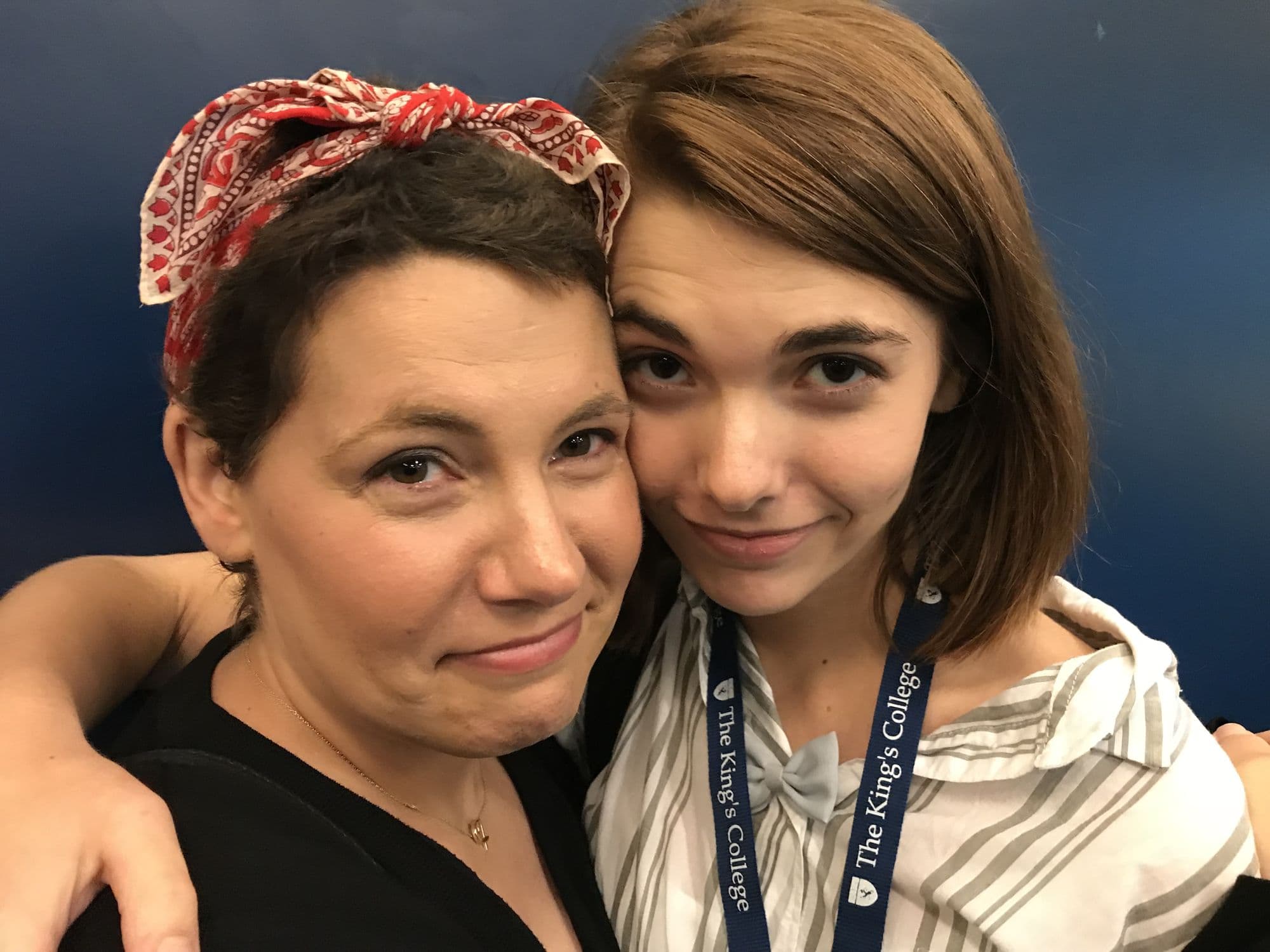 Woman with a headscarf and young woman close portrait