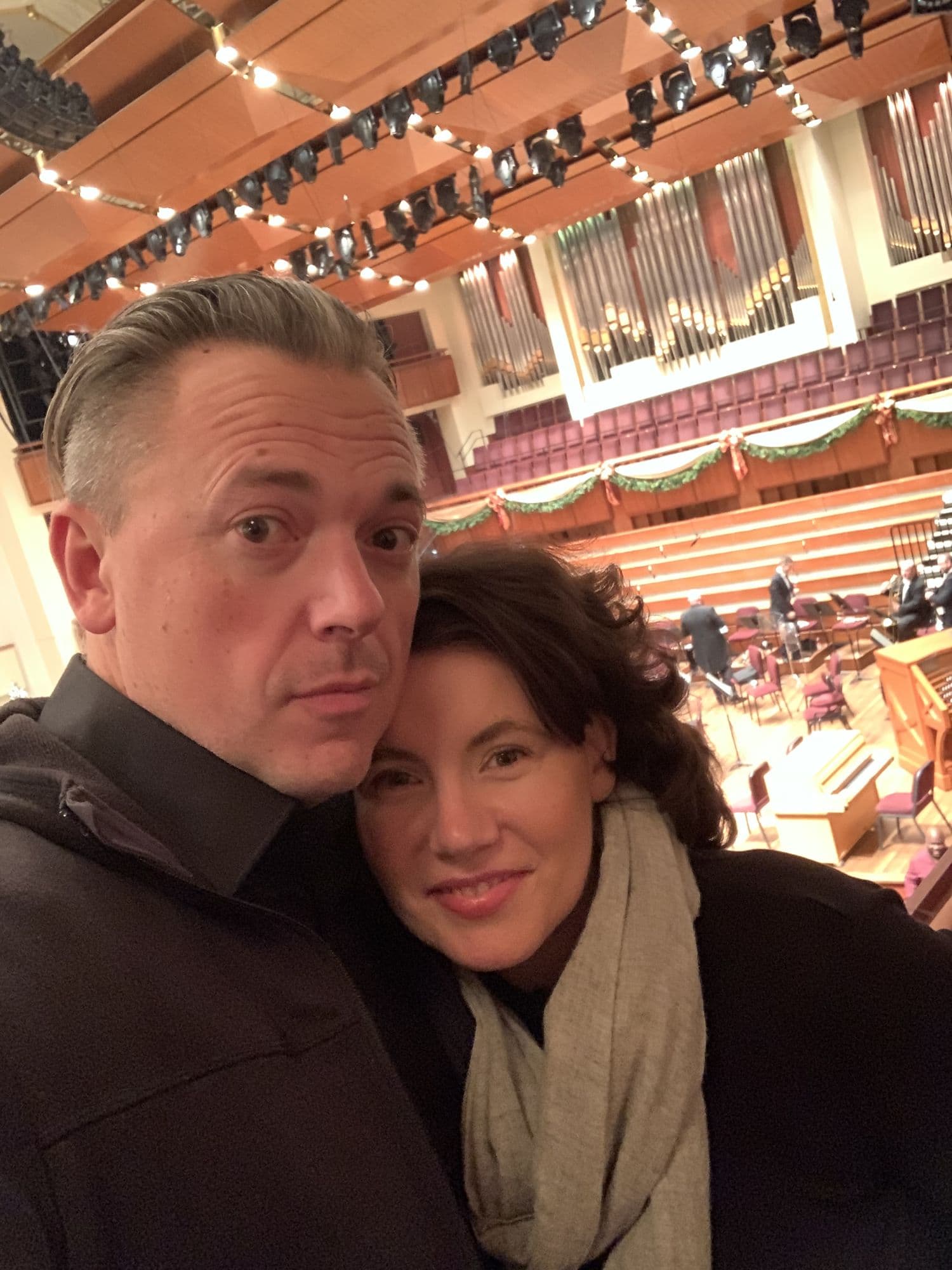 Couple selfie inside a concert hall