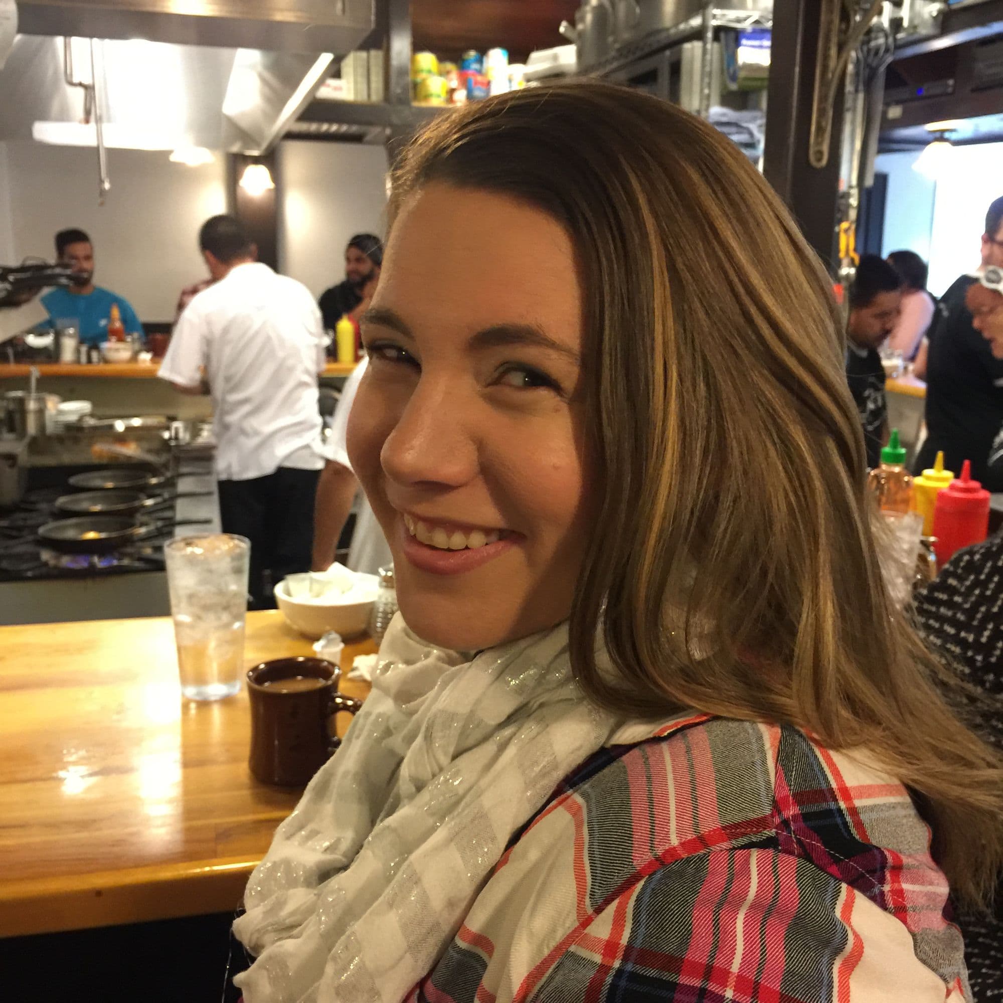 Woman smiling at restaurant bar