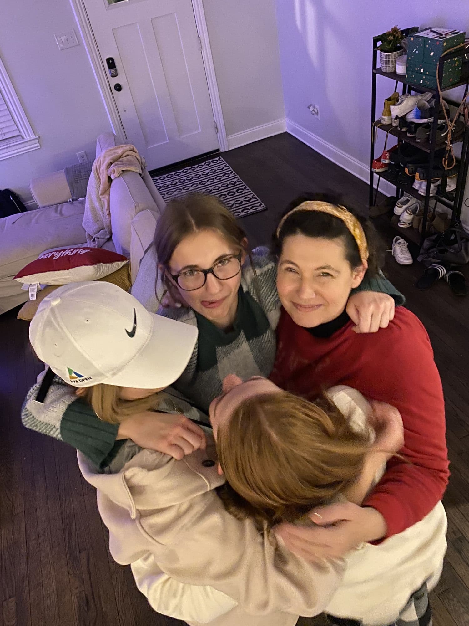 Overhead group hug in a kitchen