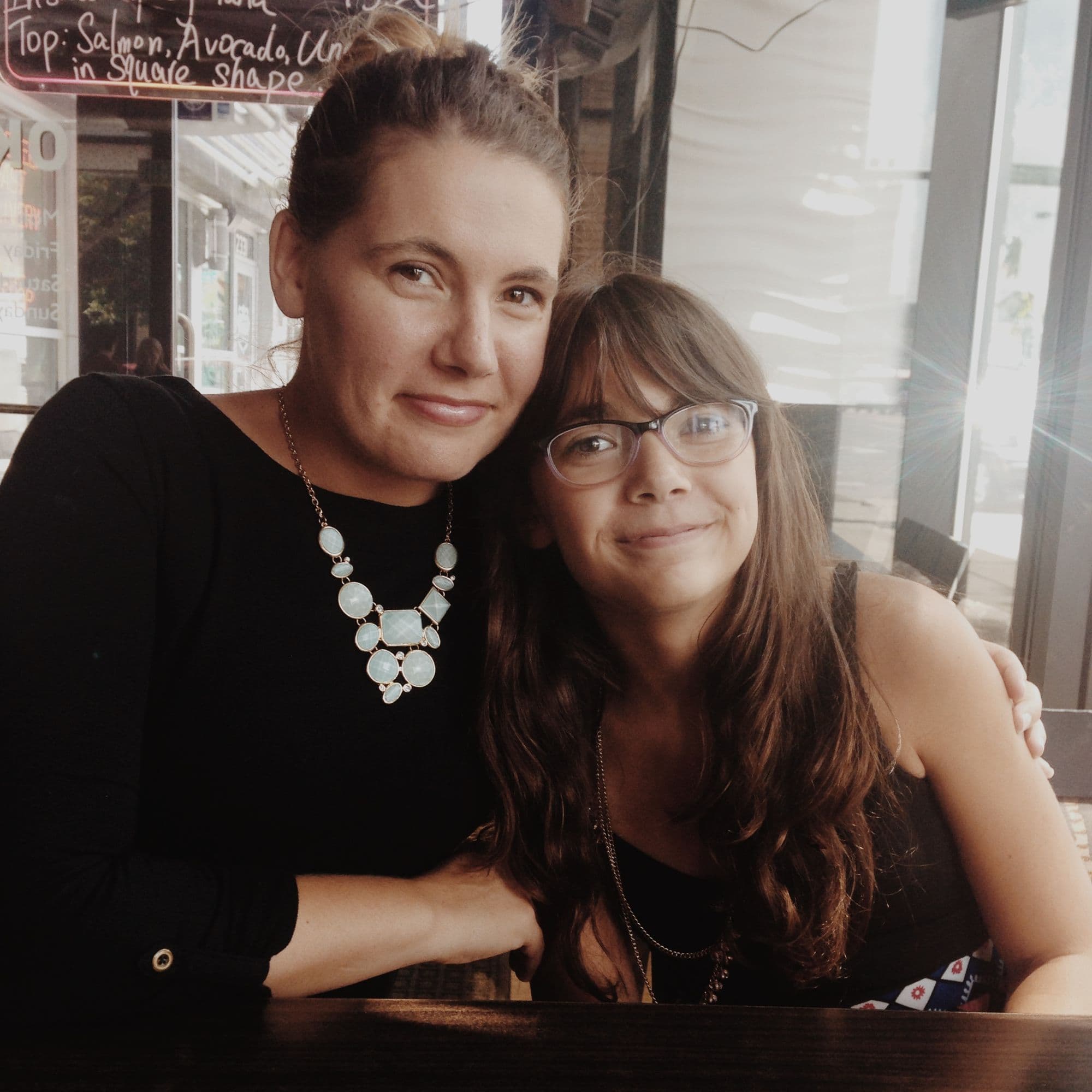 Woman and girl at cafe