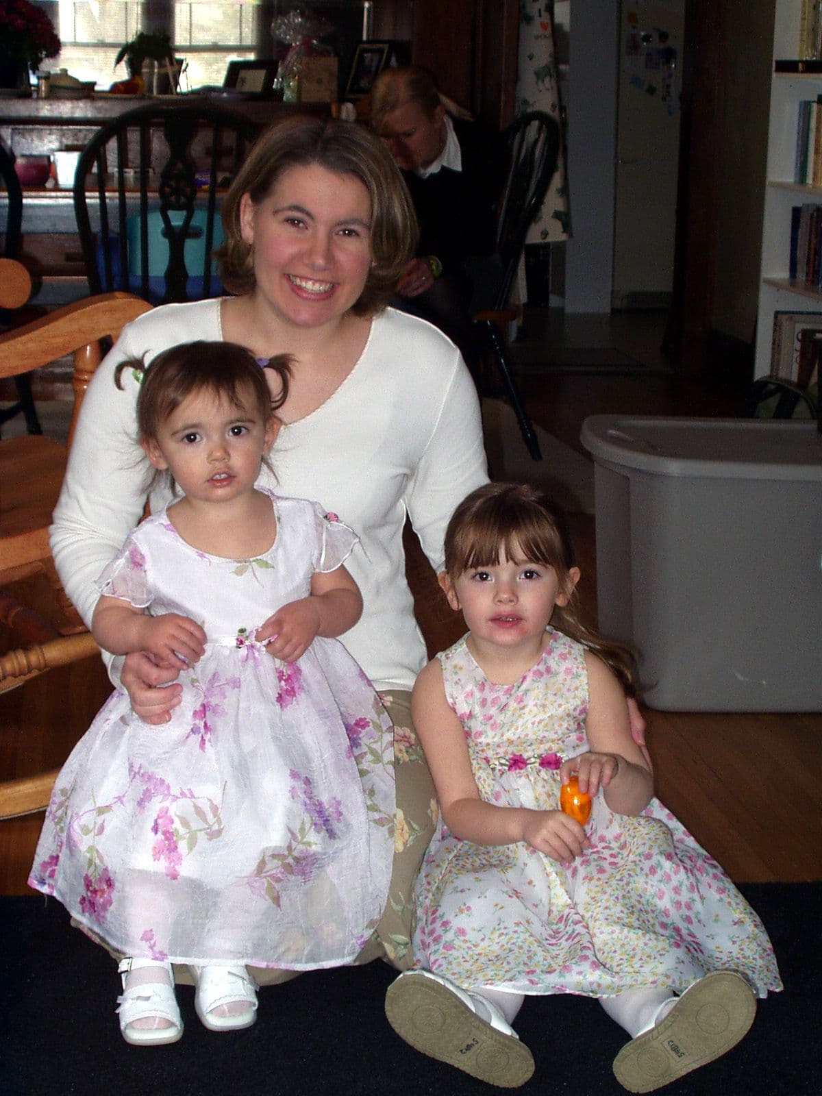 Woman and two girls in dresses
